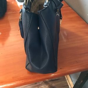 Micheal kors handbag navy in color tan inside